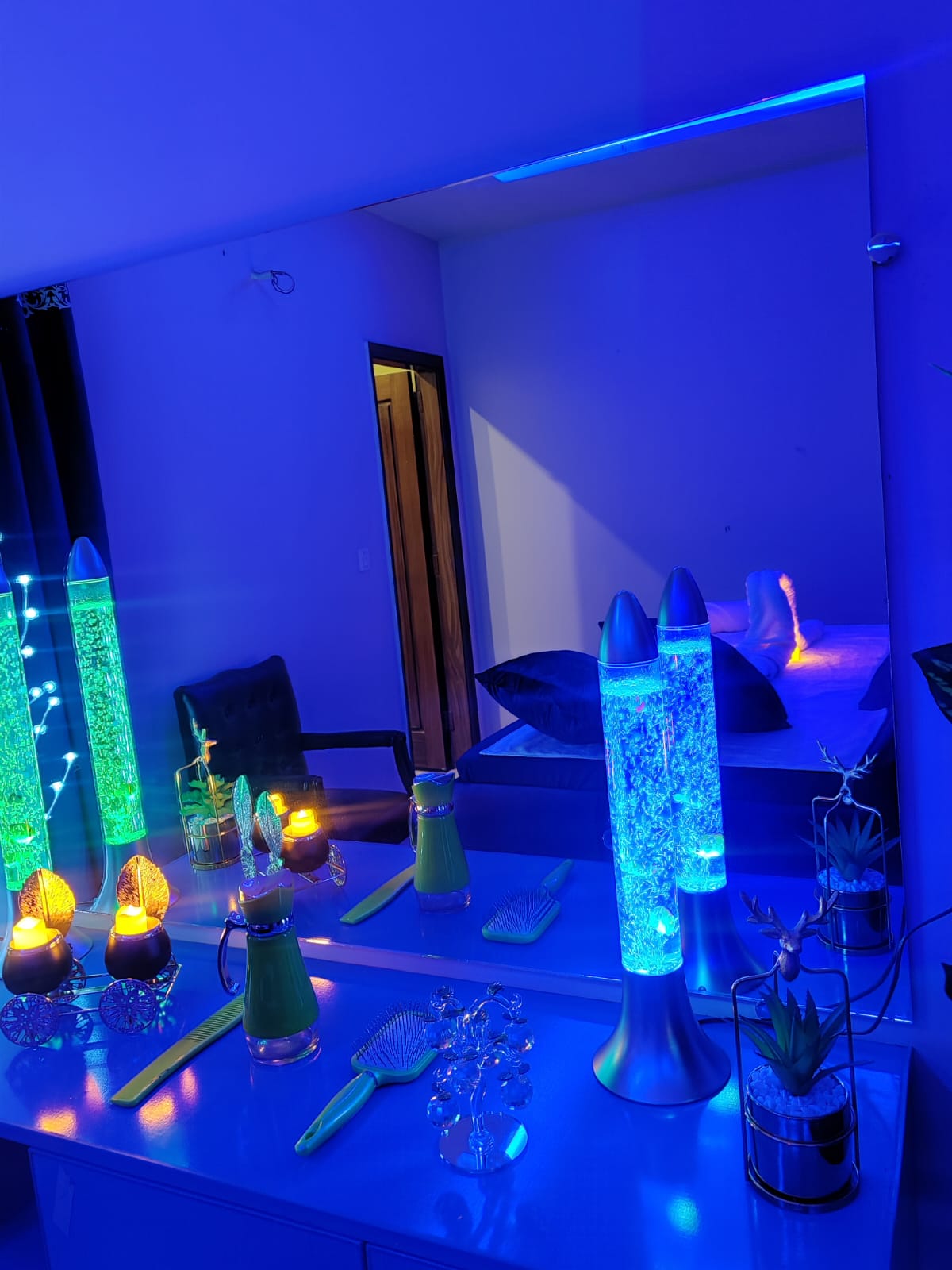 A Beautiful cupboard filled with blue lights in a spa room