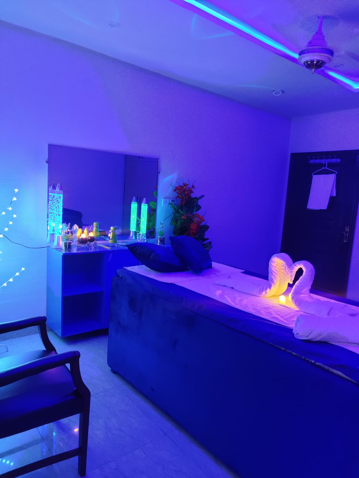Beautiful massage therapy room with blue lights